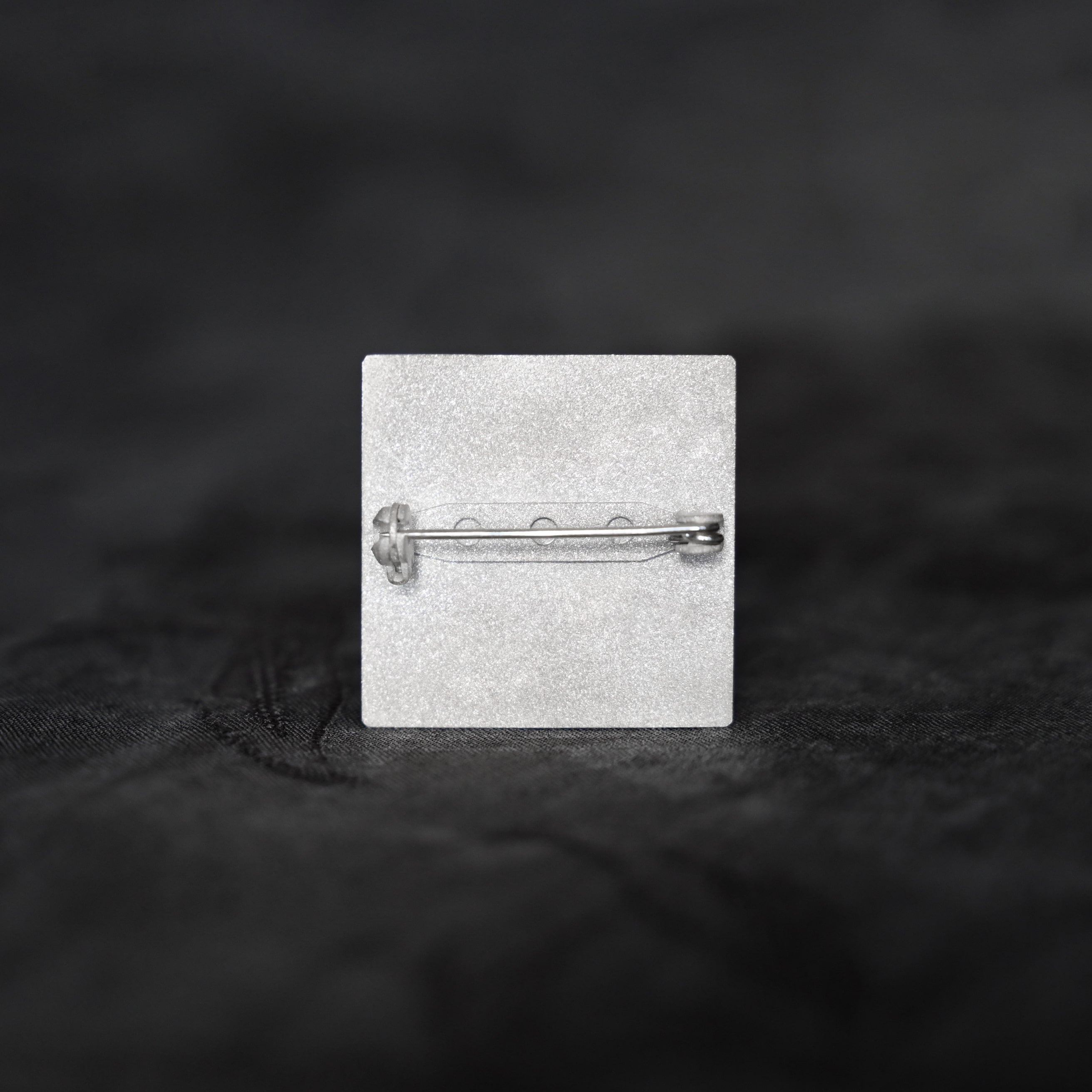 Silver brooch with orchid flowers