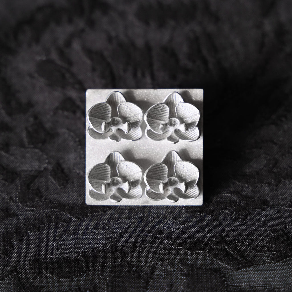 Silver brooch with orchid flowers