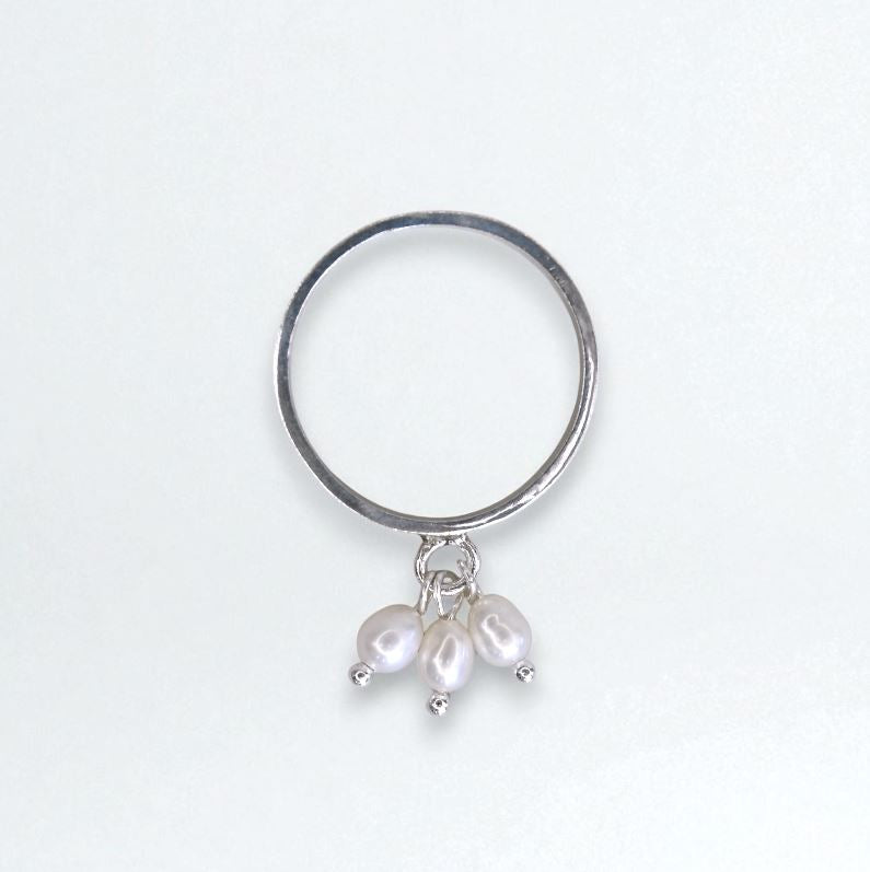 Silver ring with three dangling white pearls