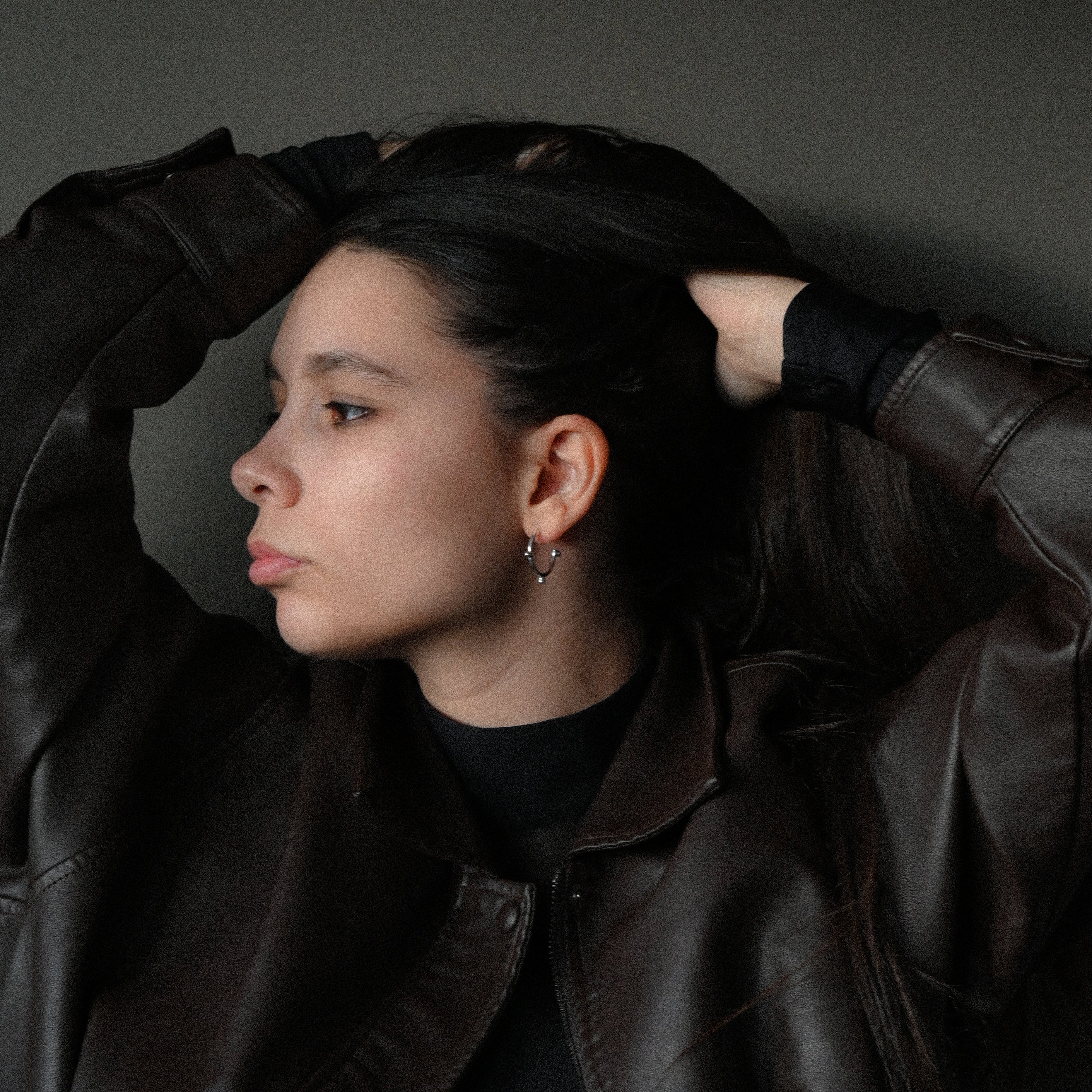 Woman wearing sterling silver hoop earring