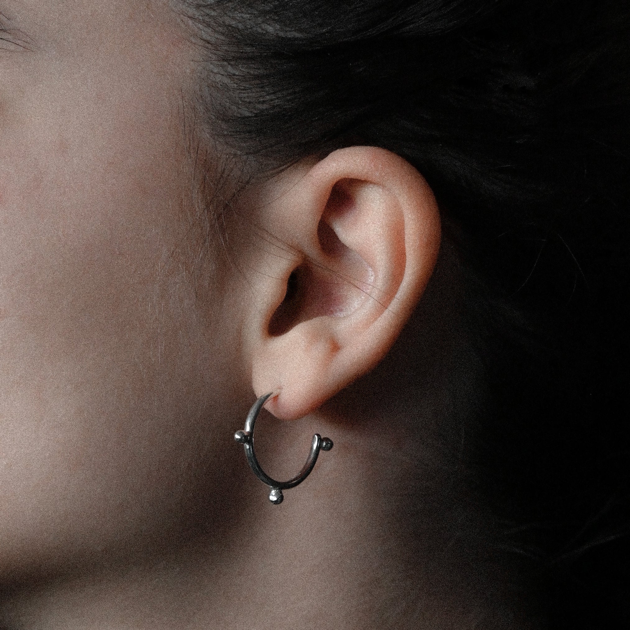 Ear with a sterling silver hoop earring