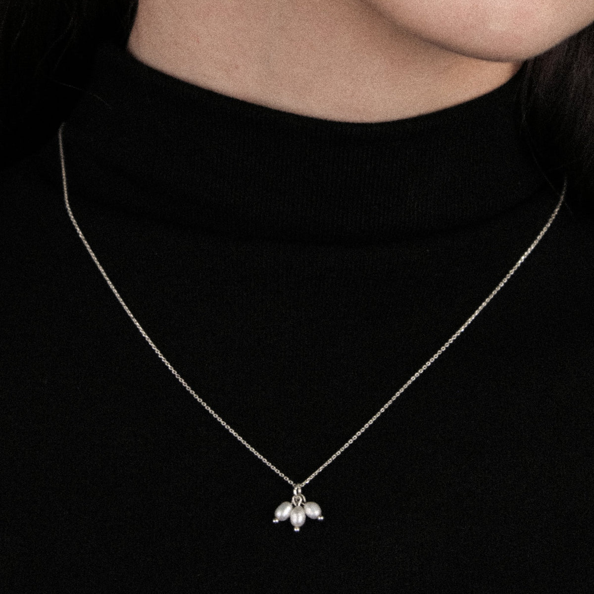Lupine handmade silver necklace featuring natural pearls