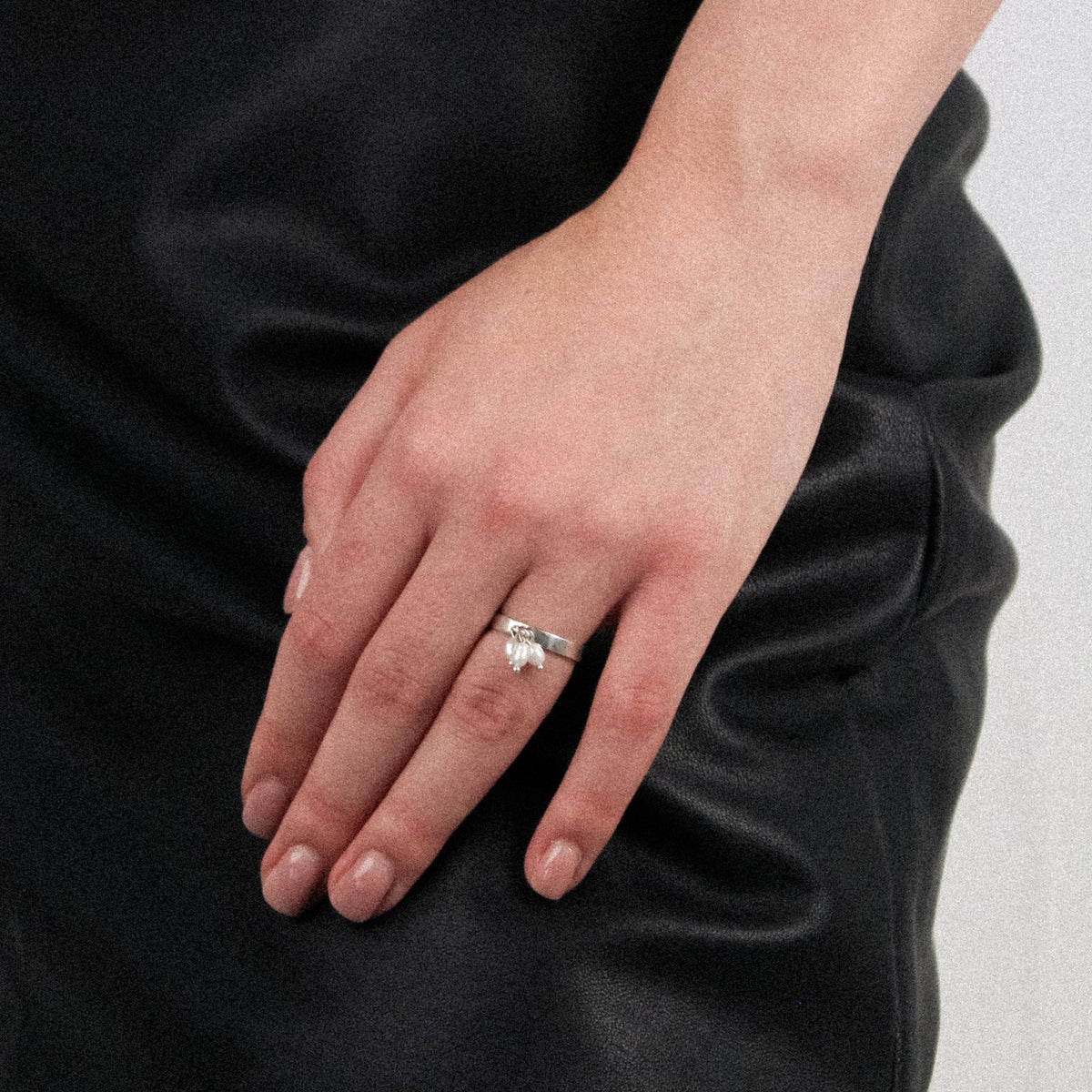 Close-up shot of the Lupine handmade silver ring with natural pearls